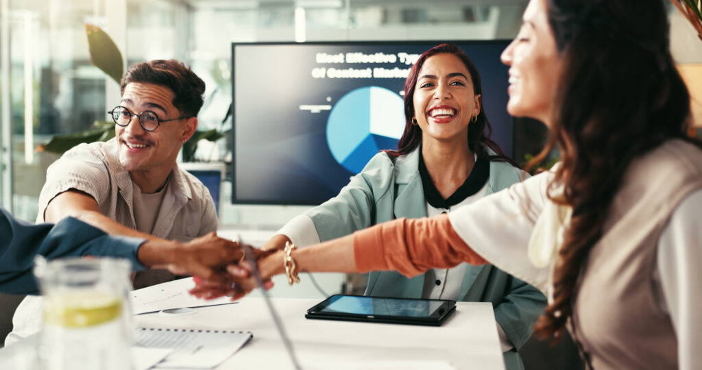 Collaboration, meeting and success with business people in office together for planning or project management. Documents, hands stack and motivation with employee team in agency workplace for unity.