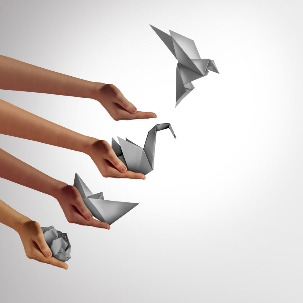 Creativity And Vision as changing for success as a leadership and business change through innovation and evolution of ability as a crumpled paper transforming into a boat then a swan and a flying bird as a metaphor.